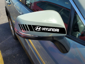Hyundai Verna with Hard Goat black stripes side mirror sticker, white logo visibl