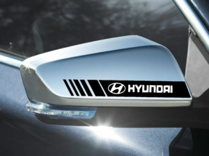 Angled view of Hyundai with Hard Goat side mirror sticker, black stripe design