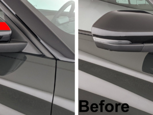 Hand applying red stripe Hard Goat Hyundai side mirror sticker, showing easy installation.